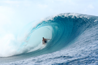 Person surfing a large wave