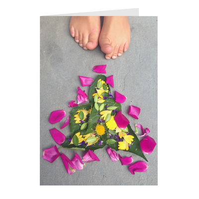 Meghan Nathanson Artistry color photo of child's toes with flower art arrangement on folded greeting card