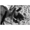 Meghan Nathanson Artistry black and white photo of a child's hands holding a ball of sandy mud on mini canvas print